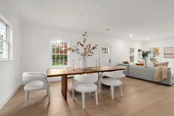 a dining room with furniture and window