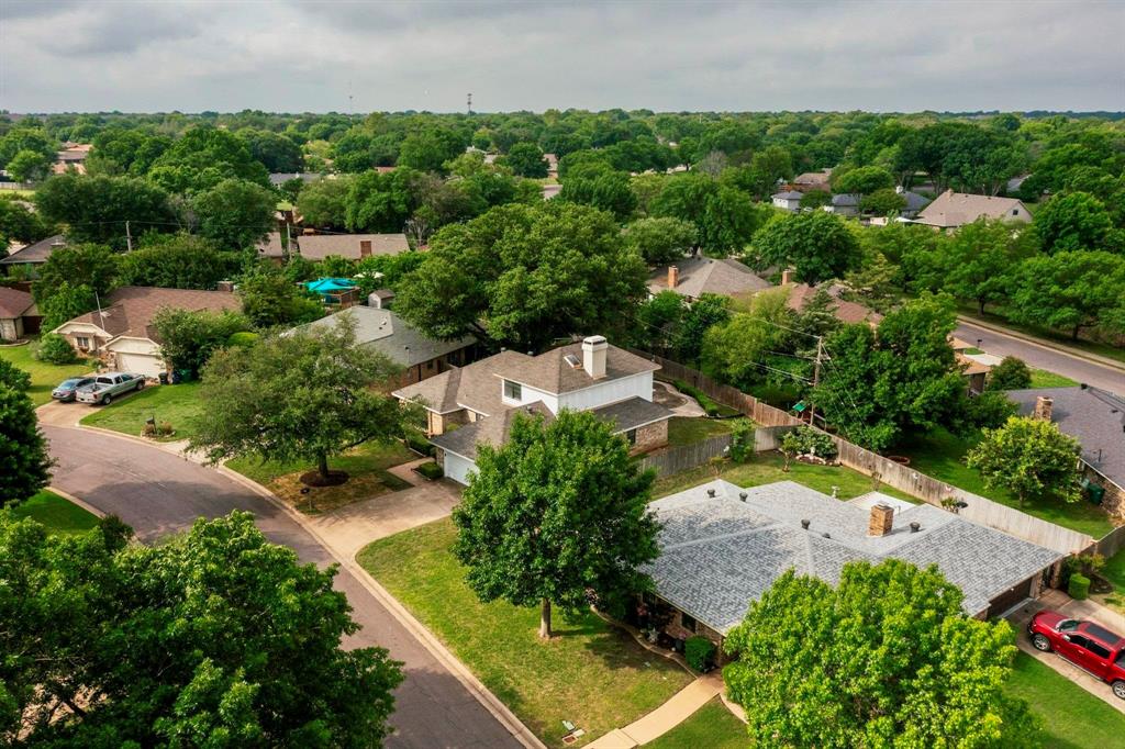 3965 Singleleaf Lane Fort Worth, TX 76133 - Photo 37 of 39 Aerial perspective showcasing a residential neighborhood with extensive mature tree cover