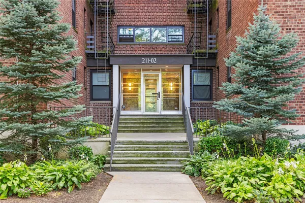a view of a pathway of the house with potted plants
