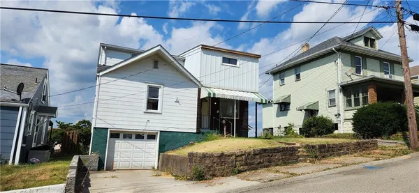 a view of a house with a street
