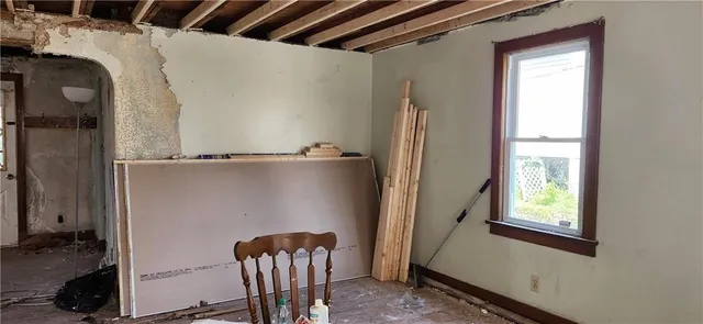 a view of balcony with furniture and a window