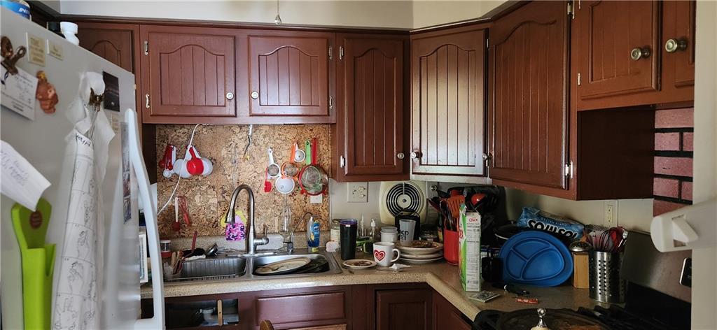 7 Jacob Street Uniontown, PA 15401 - Photo 10 of 14 a kitchen with lots of clutter and cabinets