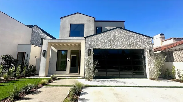 a front view of a house with yard