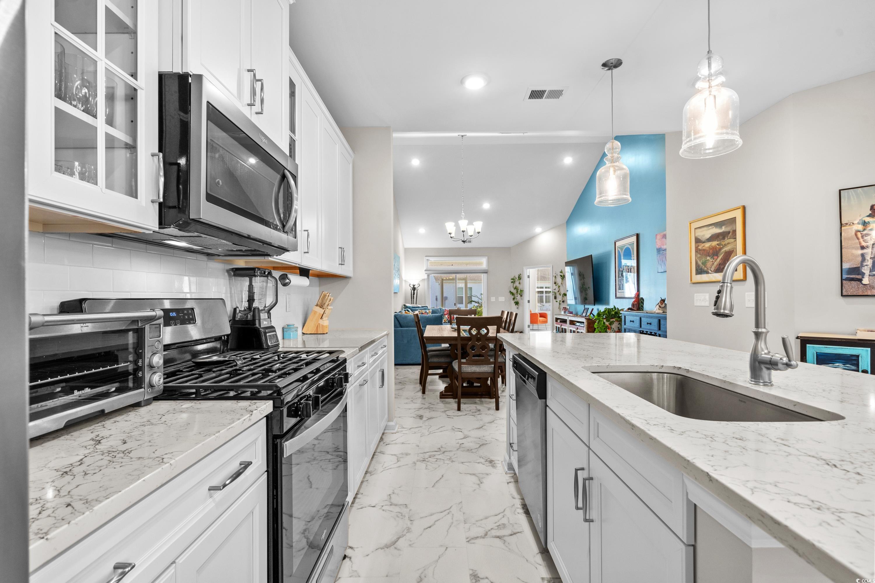 4036 D Taranto Loop, Unit 5404D Myrtle Beach, SC 29579 - Photo 16 of 39 Kitchen with stainless steel appliances, sink, pen