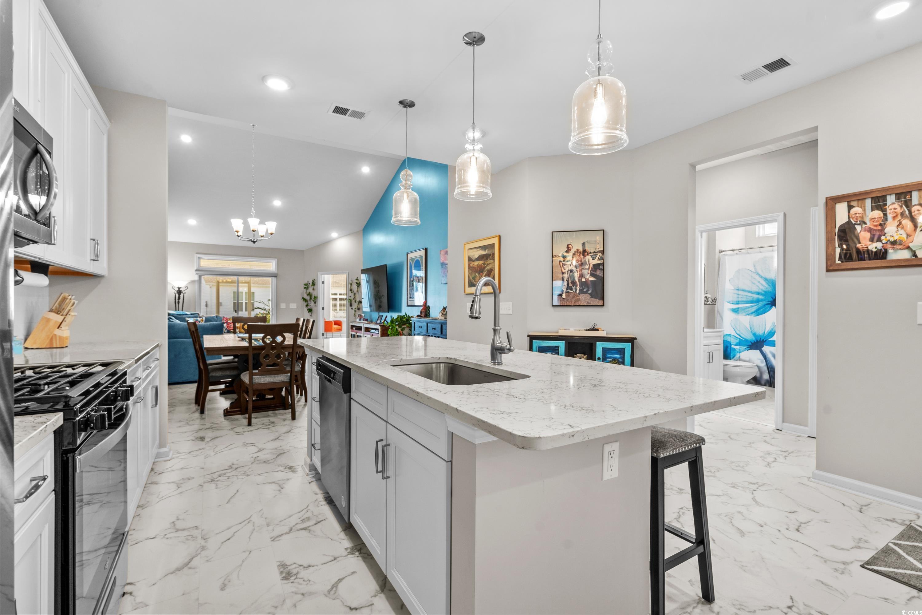 4036 D Taranto Loop, Unit 5404D Myrtle Beach, SC 29579 - Photo 17 of 39 Kitchen with stainless steel appliances, sink, a c