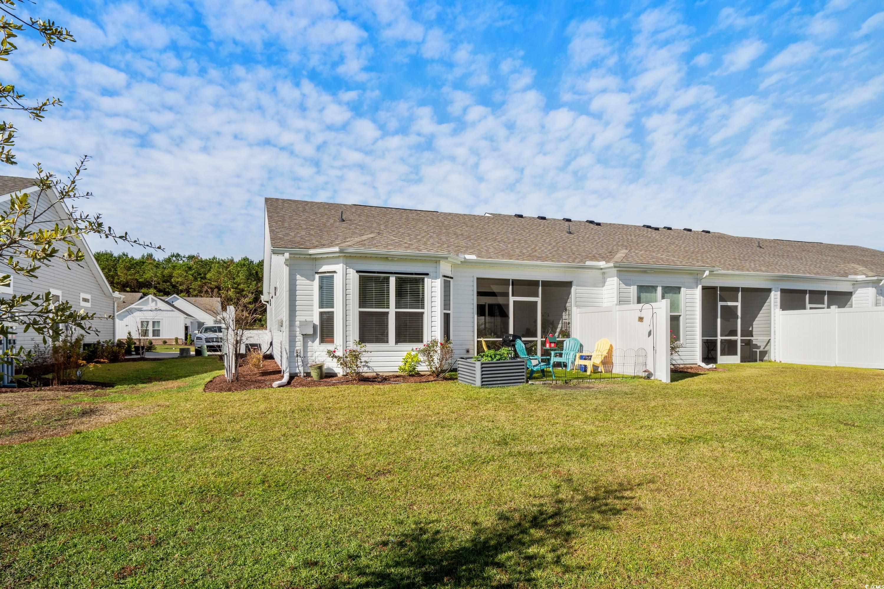 4036 D Taranto Loop, Unit 5404D Myrtle Beach, SC 29579 - Photo 23 of 39 Rear view of property featuring a sunroom and a la