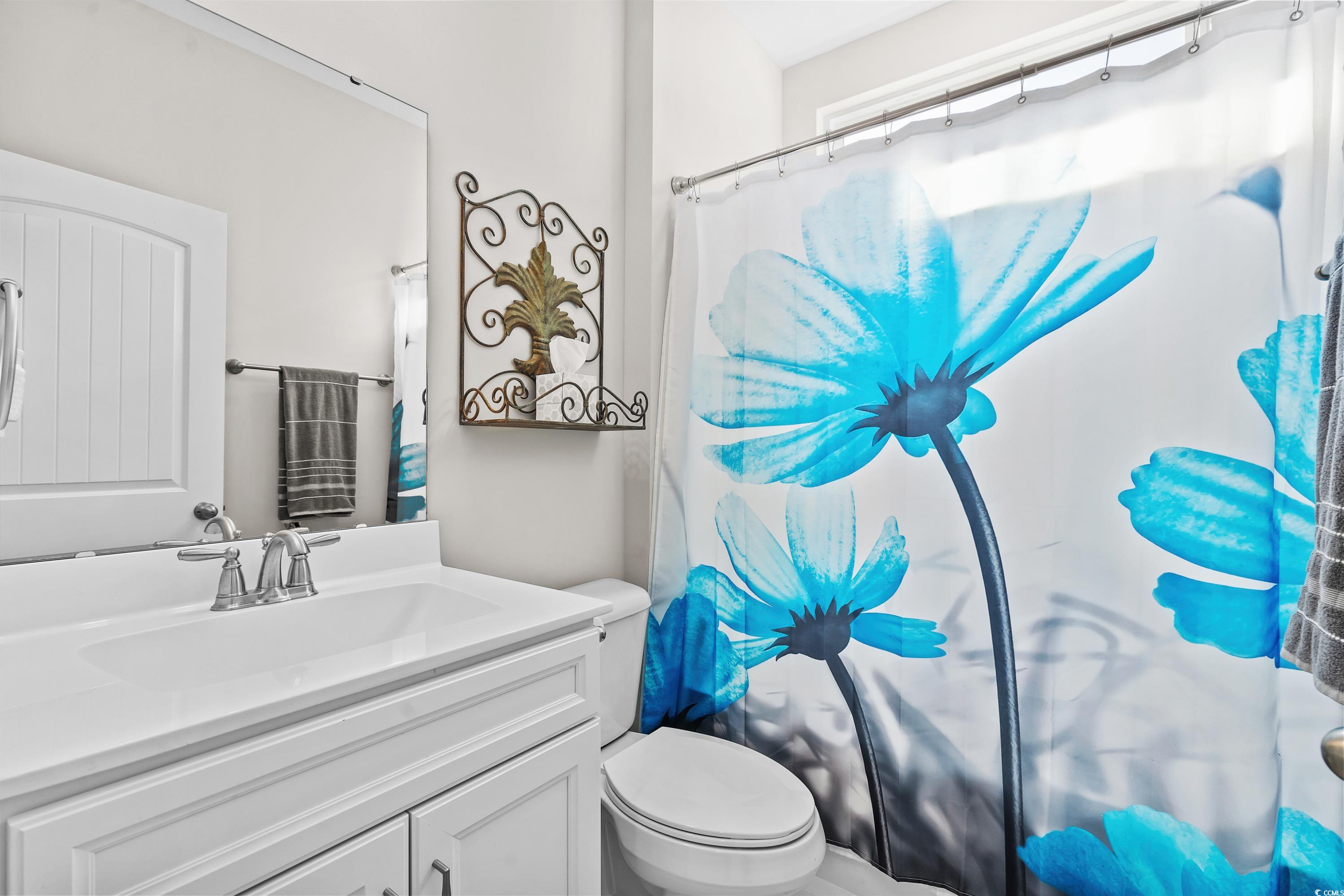 4036 D Taranto Loop, Unit 5404D Myrtle Beach, SC 29579 - Photo 32 of 39 Bathroom featuring a shower with shower curtain, v
