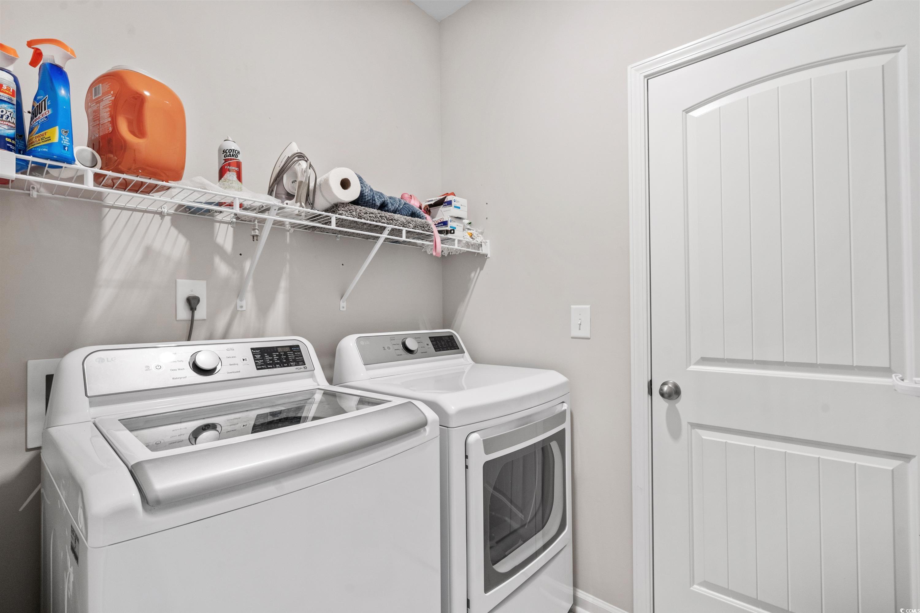 4036 D Taranto Loop, Unit 5404D Myrtle Beach, SC 29579 - Photo 33 of 39 Laundry room featuring washing machine and clothes