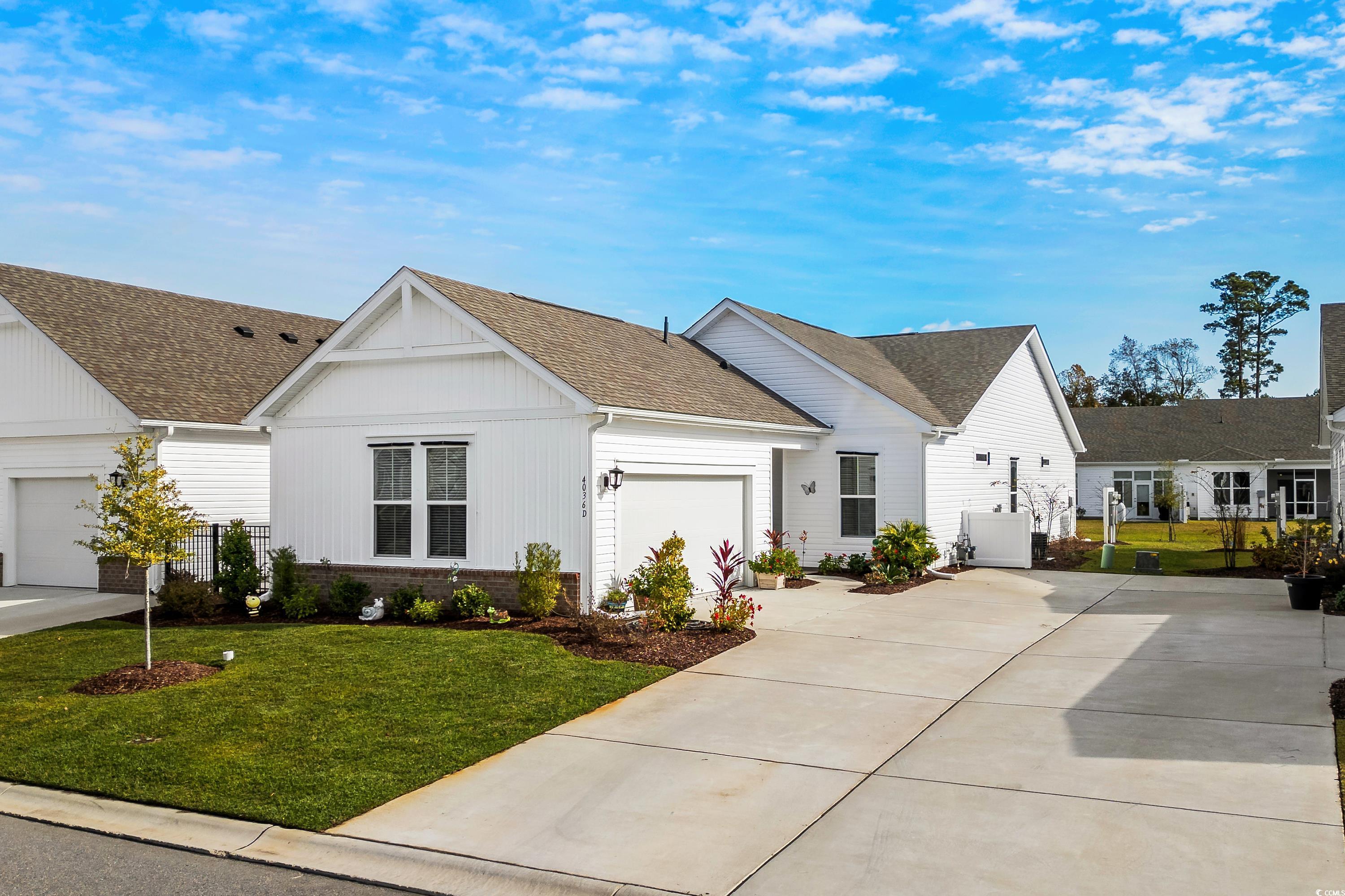 4036 D Taranto Loop, Unit 5404D Myrtle Beach, SC 29579 - Photo 34 of 39 View of front facade featuring a garage and a fron