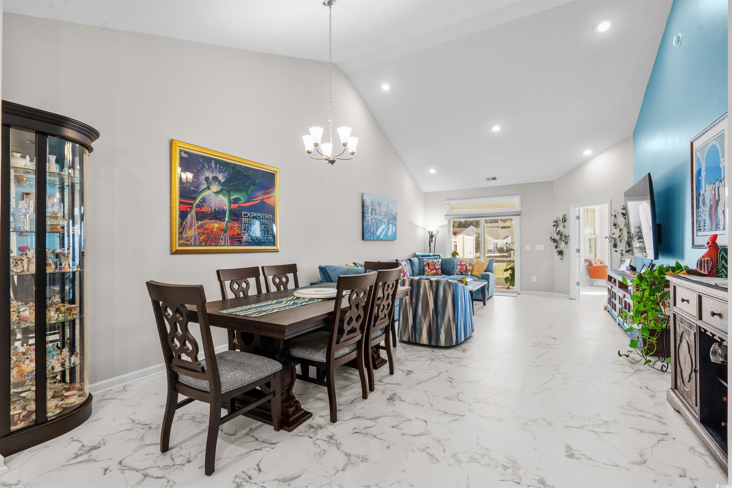 4036 D Taranto Loop, Unit 5404D Myrtle Beach, SC 29579 - Photo 5 of 39 Dining room with high vaulted ceiling and an invit