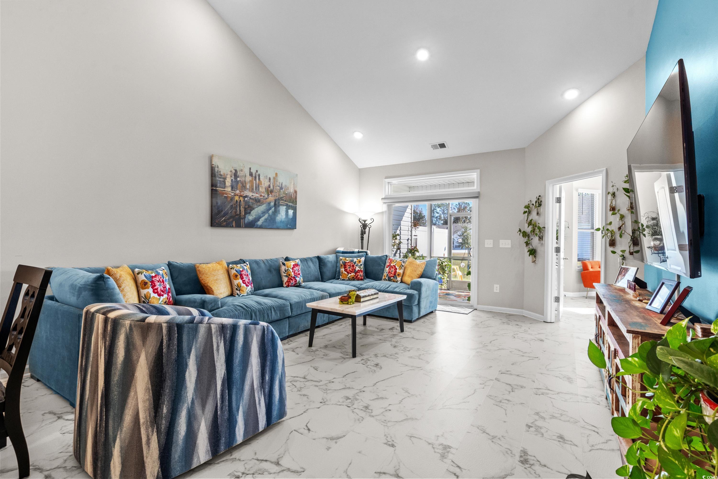 4036 D Taranto Loop, Unit 5404D Myrtle Beach, SC 29579 - Photo 6 of 39 Living room featuring high vaulted ceiling