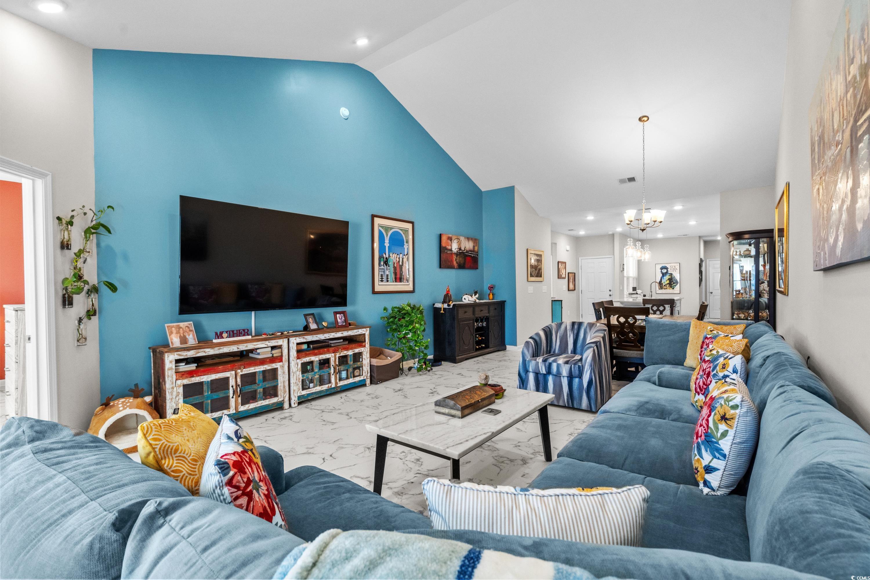 4036 D Taranto Loop, Unit 5404D Myrtle Beach, SC 29579 - Photo 8 of 39 Living room with high vaulted ceiling and an invit