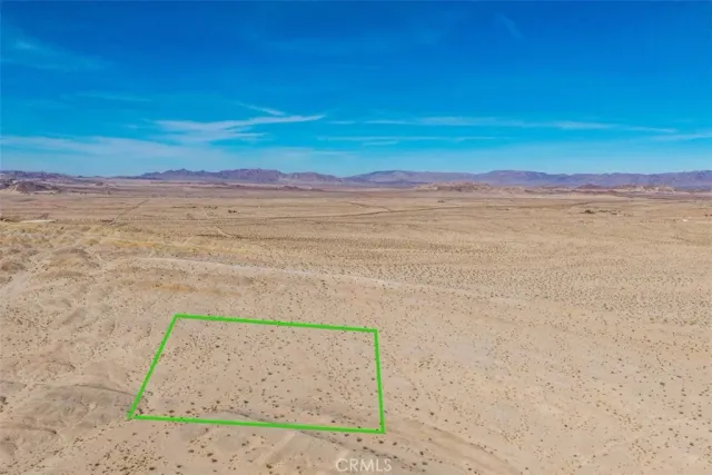 a view of a yard with an ocean view