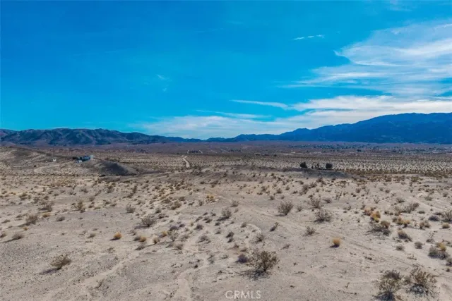 a view of beach and a large window