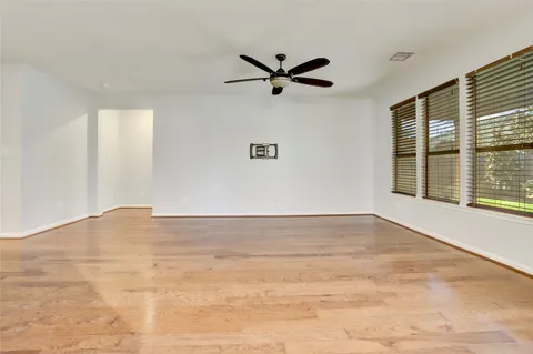 a view of kitchen with granite countertop cabinets and refrigerator