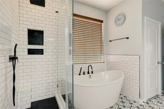 a bathroom with a double vanity sink mirror and