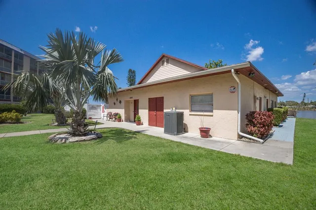 a front view of a house with a yard patio and fire pit