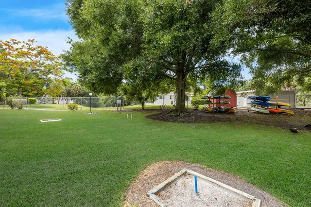 a view of a park with large trees