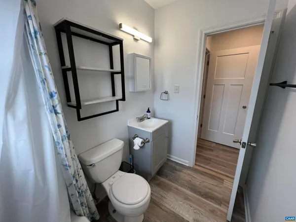 a white toilet sitting next to a bathroom sink