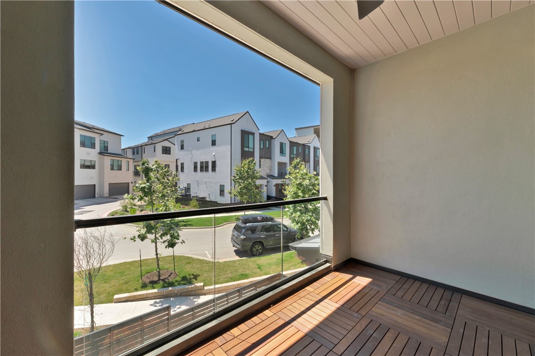4611 Unity Circle Austin, TX 78731 - Photo 9 of 40 Pretty views from the covered balcony on the second floor.