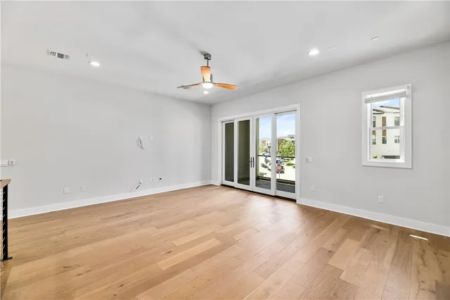 a view of room with furniture and wooden floor