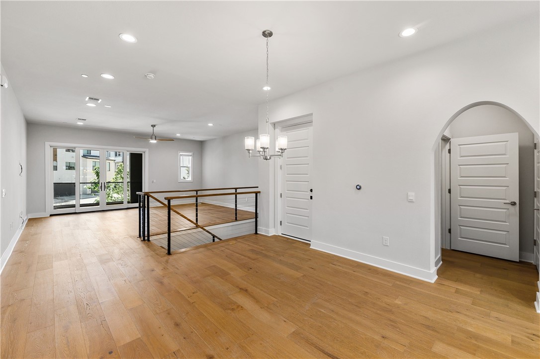 4611 Unity Circle Austin, TX 78731 - Photo 14 of 40 View of the dining room. The door near the stairs goes to the elevator. The arched doorway leads to the powder room and a storage closet.