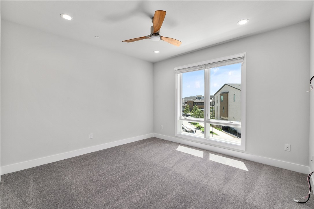 4611 Unity Circle Austin, TX 78731 - Photo 18 of 40 The large primary bedroom is on the third floor and includes a spa-like bath