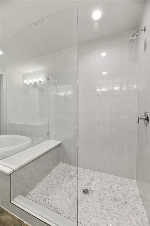 4611 Unity Circle Austin, TX 78731 - Photo 25 of 40 Beautiful walk-in shower with frameless glass.