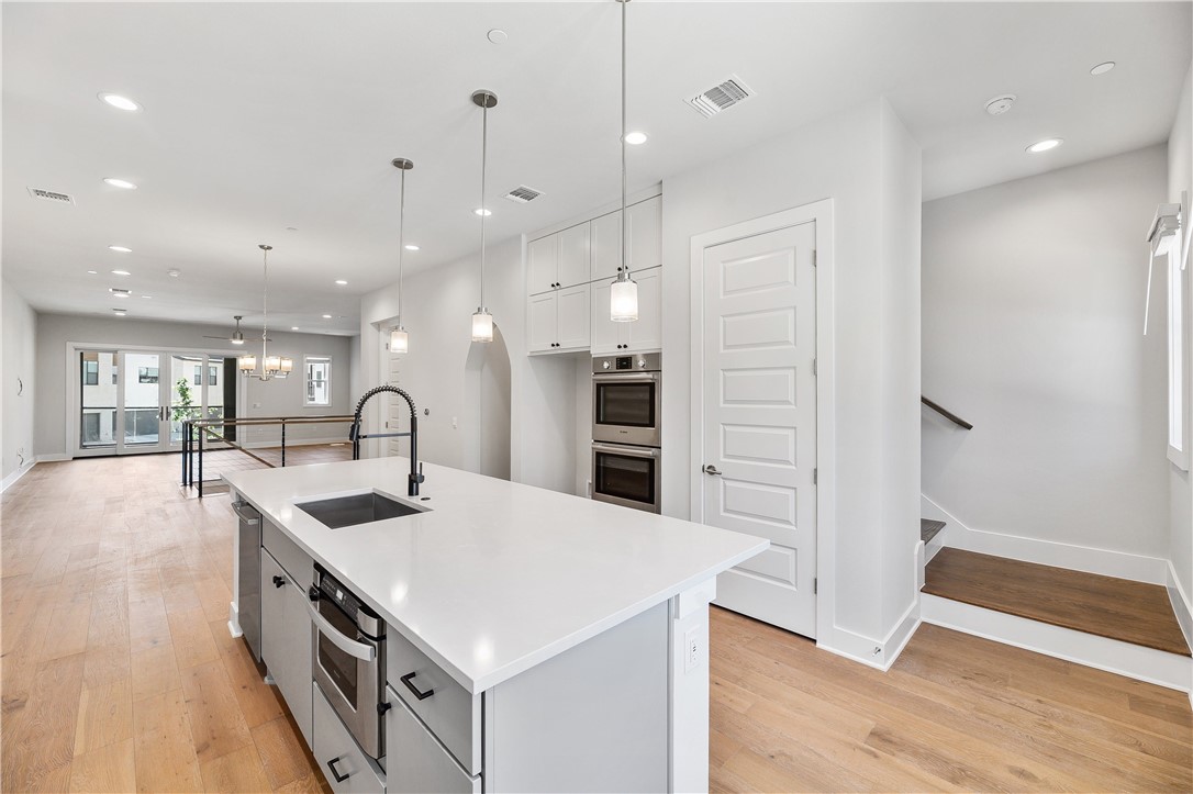 4611 Unity Circle Austin, TX 78731 - Photo 30 of 40 View of kitchen showing stairwell up to the third floor.