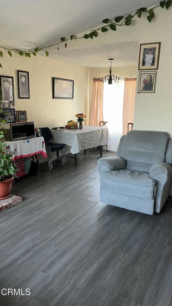 5215 Jefferson Square Oxnard, CA 93033 - Photo 3 of 12 a living room with furniture and wooden floor