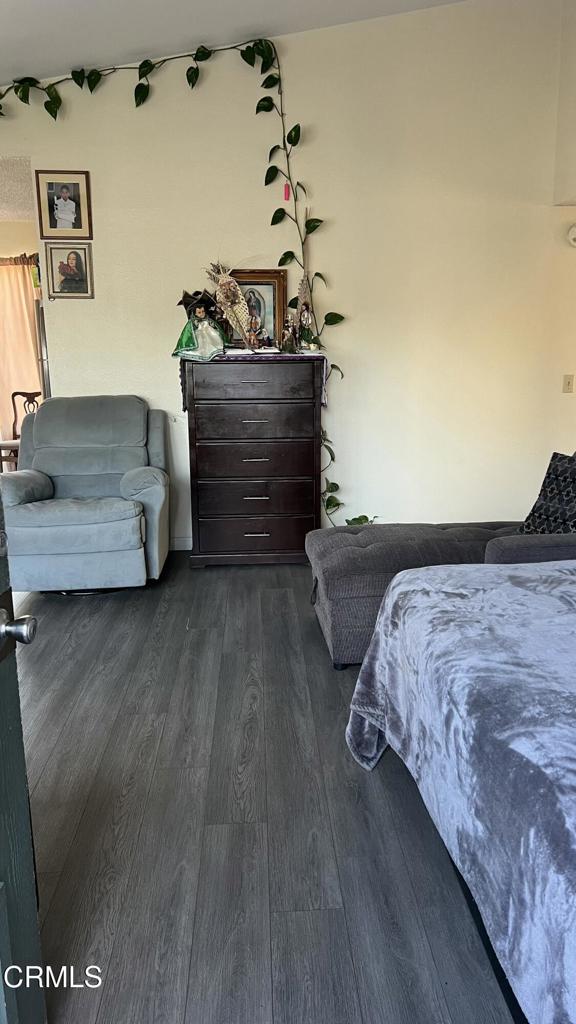 5215 Jefferson Square Oxnard, CA 93033 - Photo 4 of 12 a bedroom with bed and wooden floor