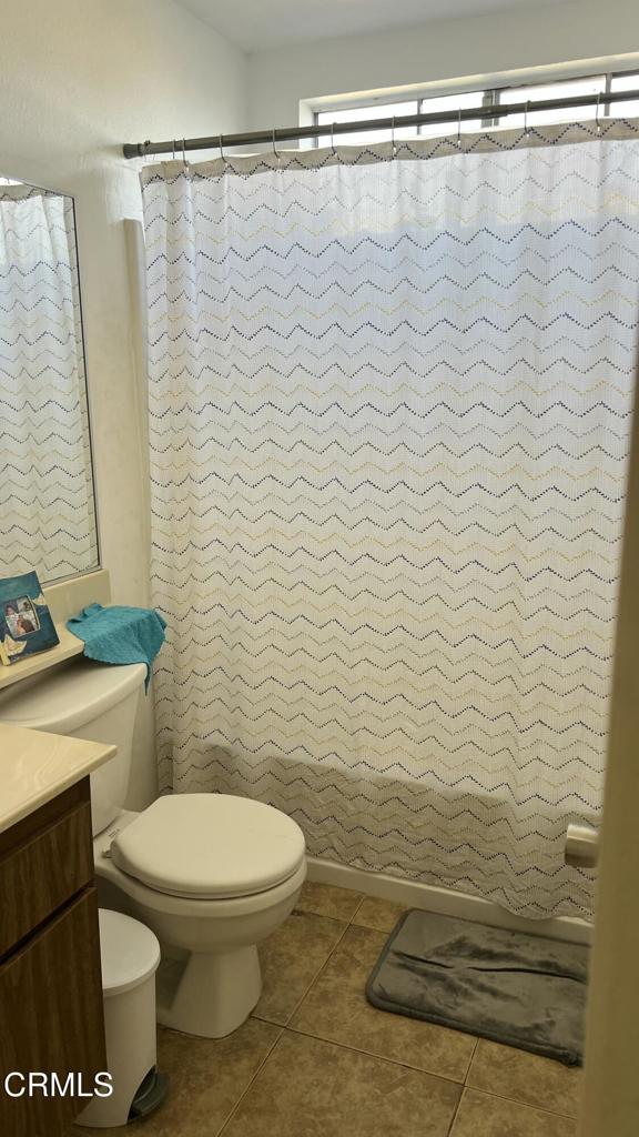 5215 Jefferson Square Oxnard, CA 93033 - Photo 10 of 12 a bathroom with a toilet and a shower curtain