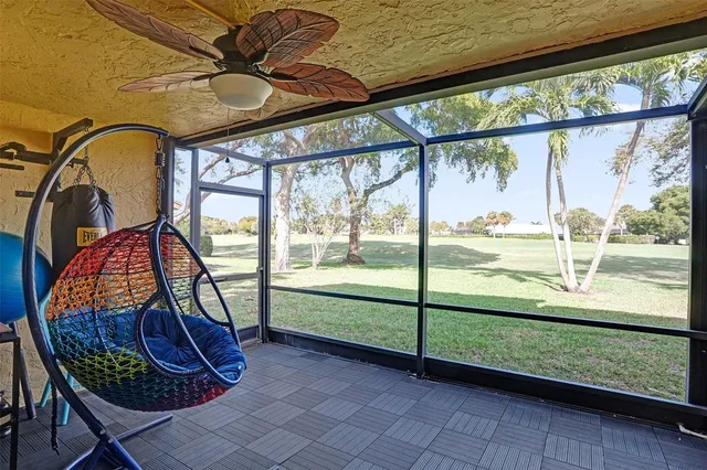a view of sitting area in balcony with wooden floor