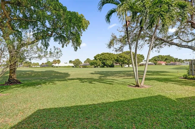 a view of a golf course with a lake