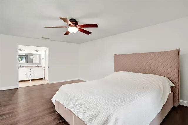 a large white bed in a white room