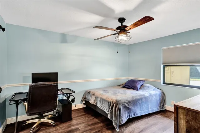 a bedroom with a bed and a desk