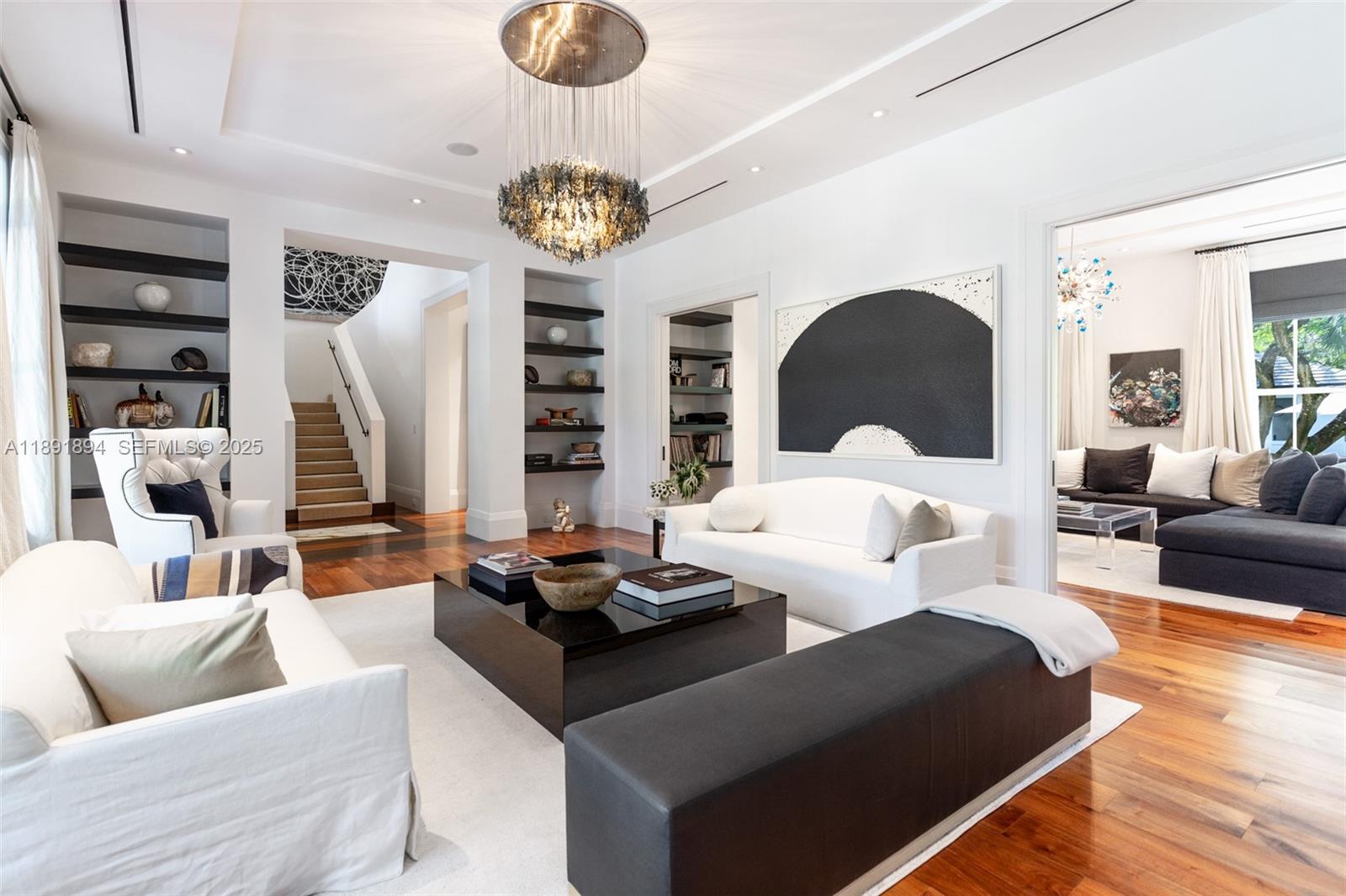 8150 School House Road Miami, FL 33143 - Photo 15 of 27 a living room with furniture kitchen and a chandelier