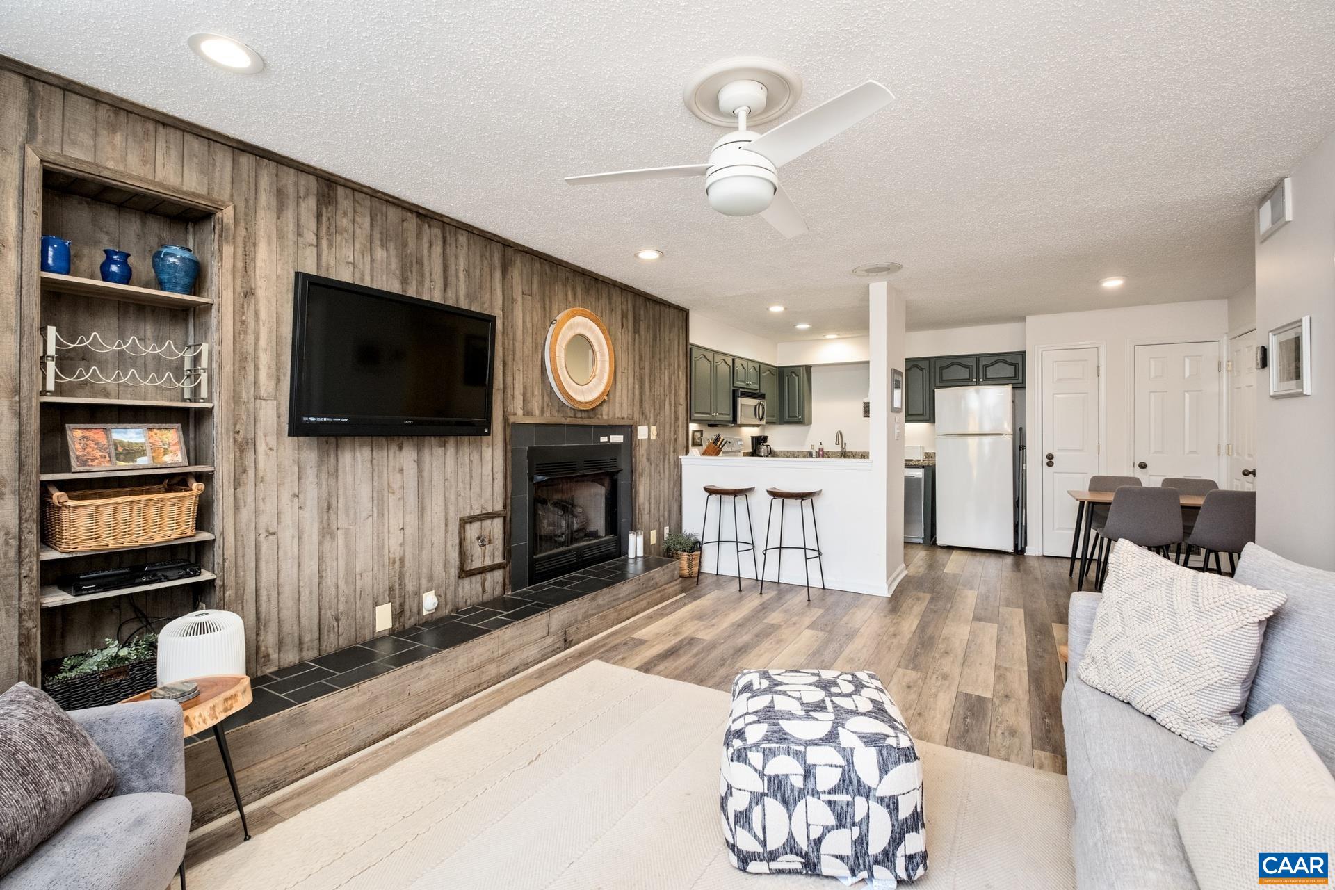 2028 Stone Ridge Roseland, VA 22967 - Photo 2 of 23 a living room with stainless steel appliances furniture and a flat screen tv