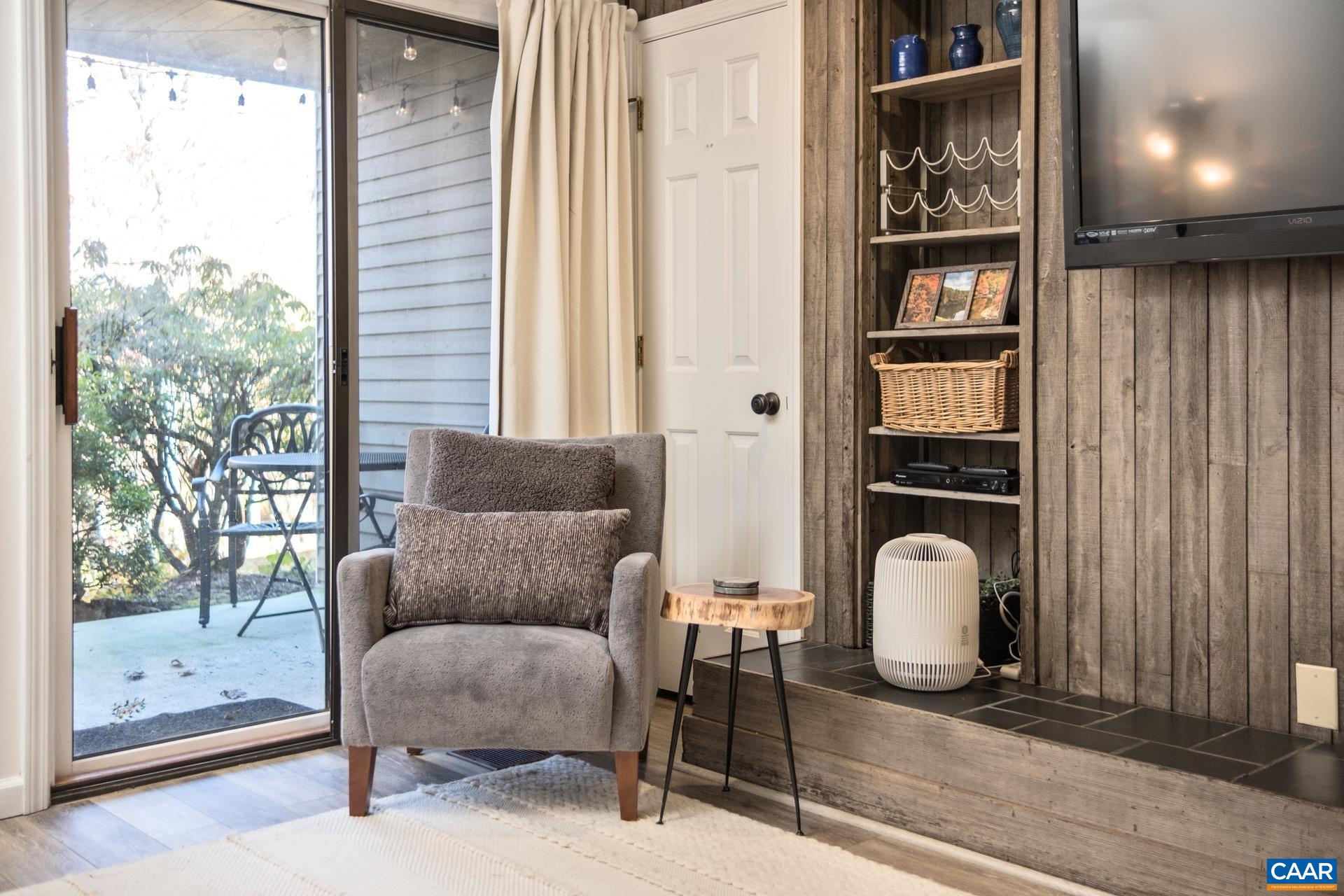 2028 Stone Ridge Roseland, VA 22967 - Photo 3 of 23 a living room with furniture a lamp and a window