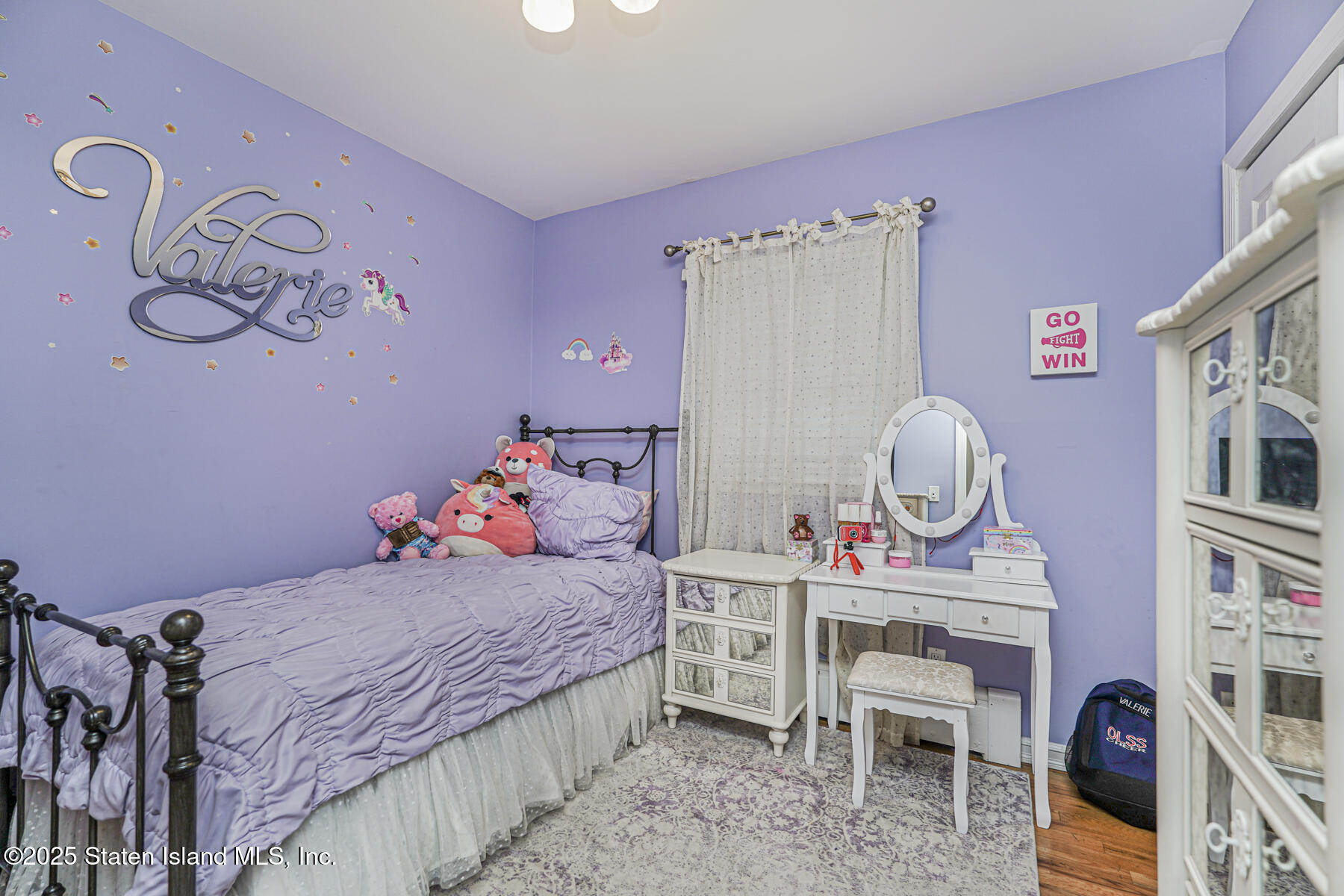 82 Woods Of Arden Road Staten Island, NY 10312 - Photo 15 of 30 a bedroom with a bed and cabinets