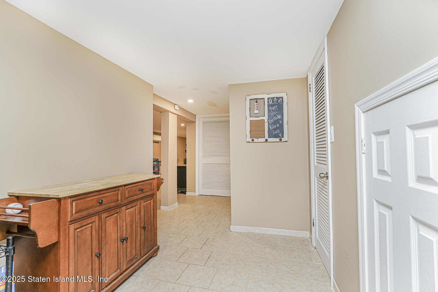 82 Woods Of Arden Road Staten Island, NY 10312 - Photo 20 of 30 an entryway with wooden floor