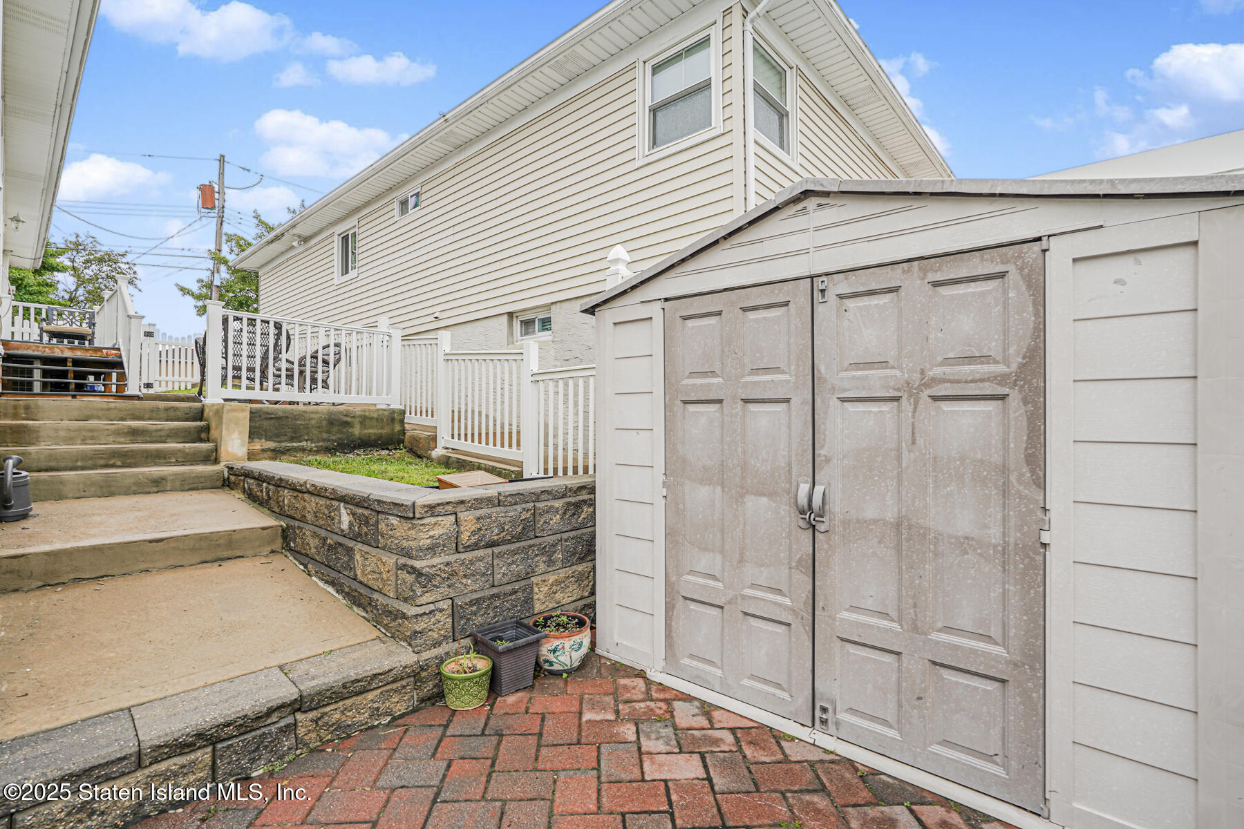 82 Woods Of Arden Road Staten Island, NY 10312 - Photo 28 of 30 a view of a porch with wooden floor