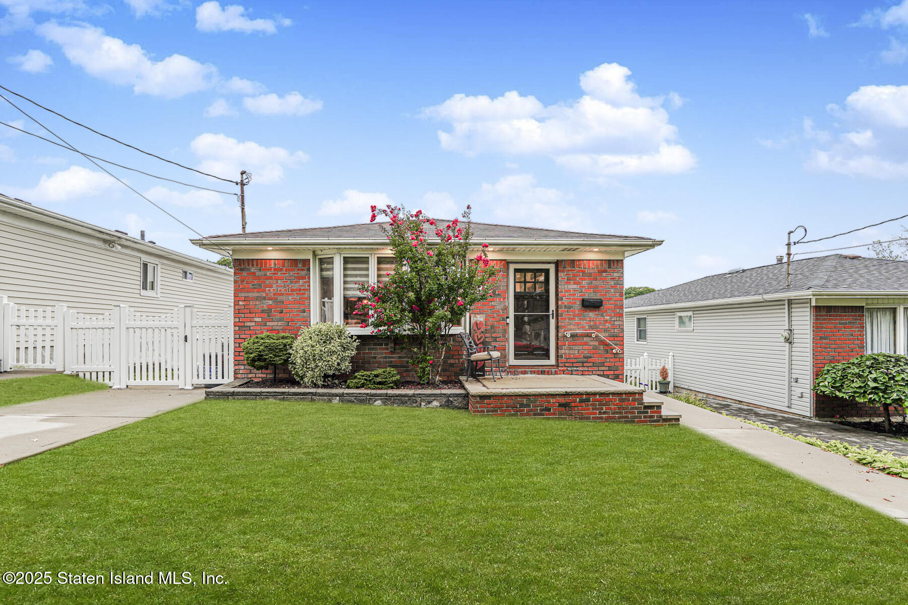 82 Woods Of Arden Road Staten Island, NY 10312 - Photo 3 of 30 a view of a house with a yard and plants