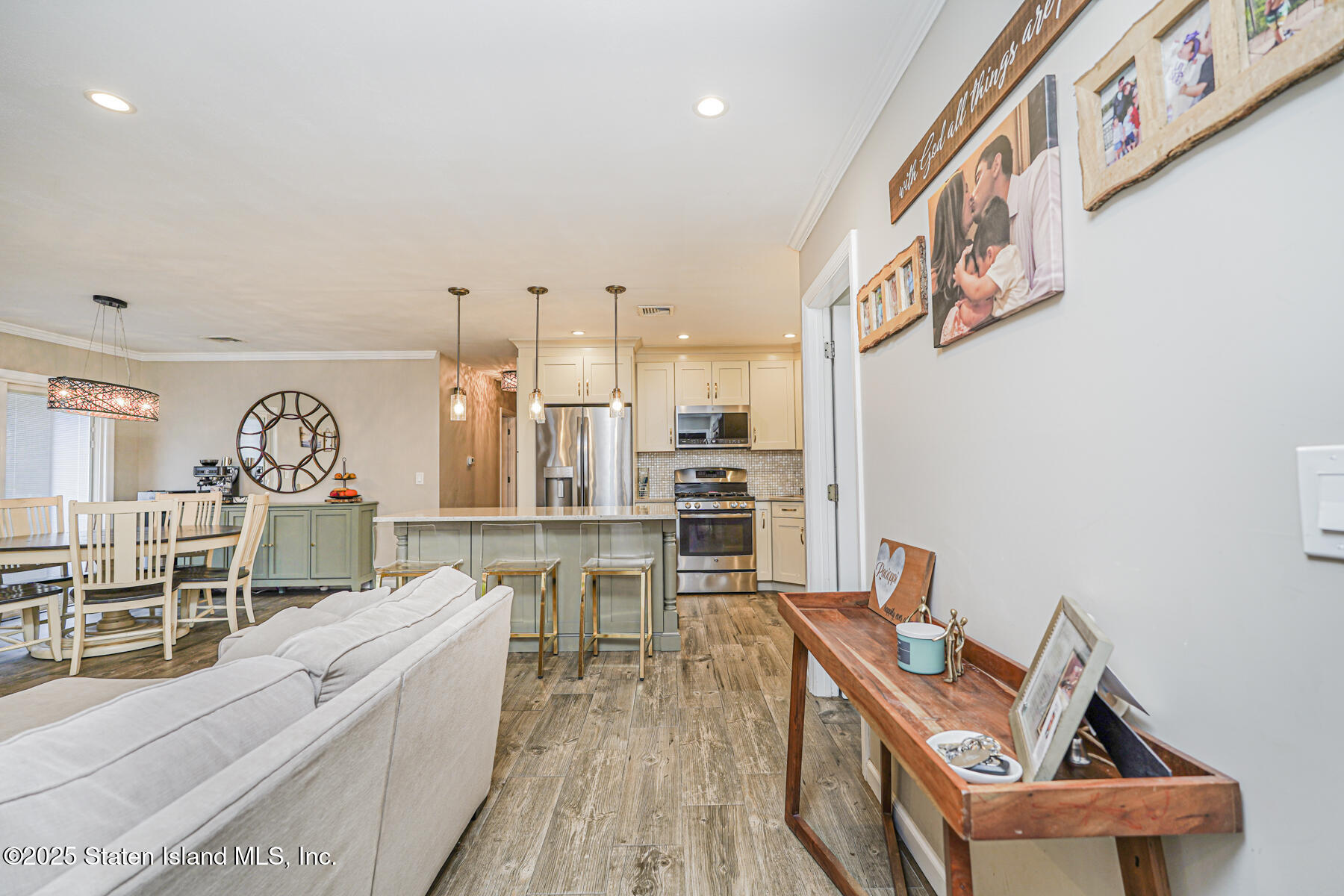 82 Woods Of Arden Road Staten Island, NY 10312 - Photo 7 of 30 a living room with furniture a rug and white walls