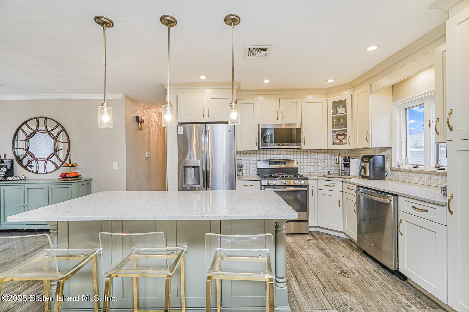 82 Woods Of Arden Road Staten Island, NY 10312 - Photo 8 of 30 a kitchen with stainless steel appliances granite countertop a stove a sink and a refrigerator