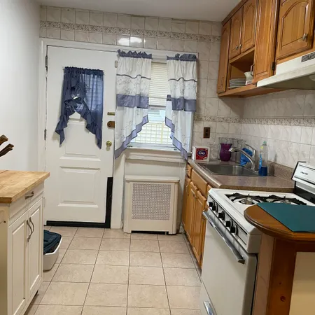 a kitchen with a stove and a refrigerator