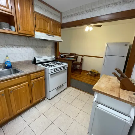 a kitchen with cabinets appliances and a sink