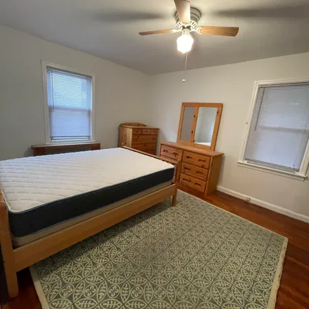 a bedroom with a bed and a dresser
