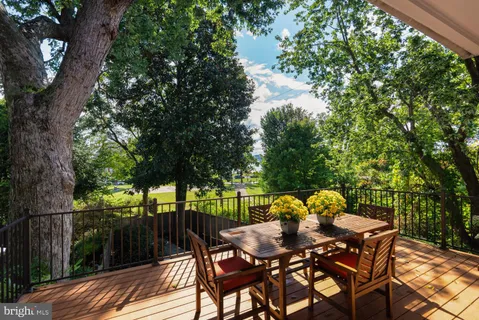 a view of a table and chairs in patio of the house
