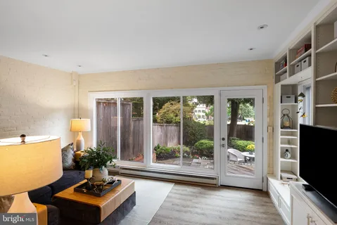 a bathroom with a granite countertop sink and mirror